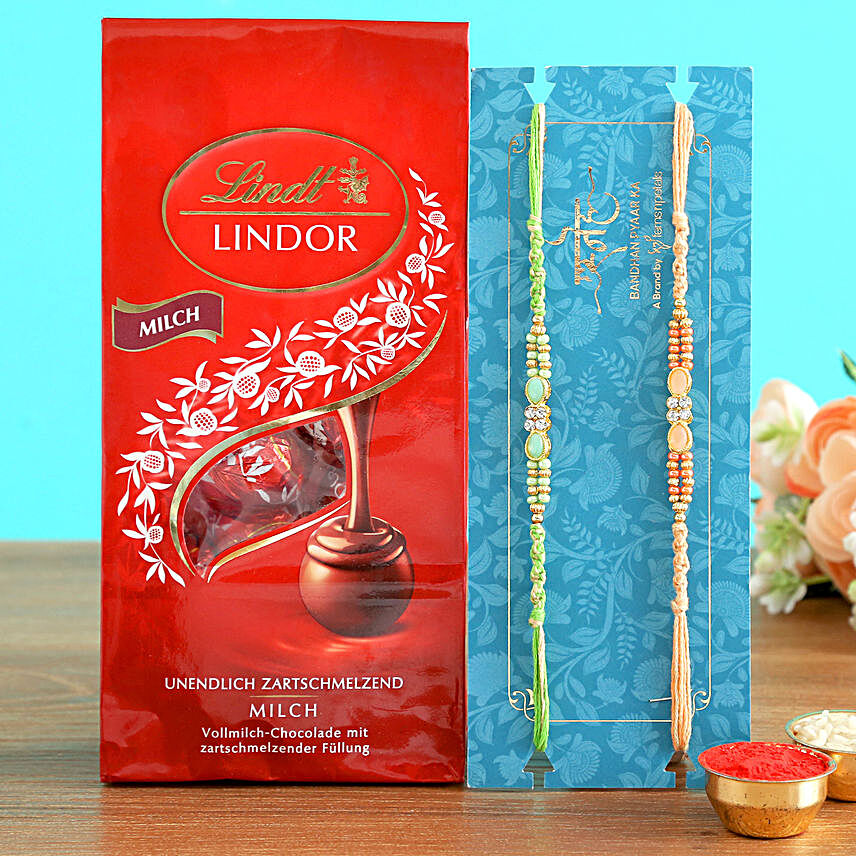 2 Stone Rakhis And Lindt Lindor Milch Chocolates:Designer Rakhi