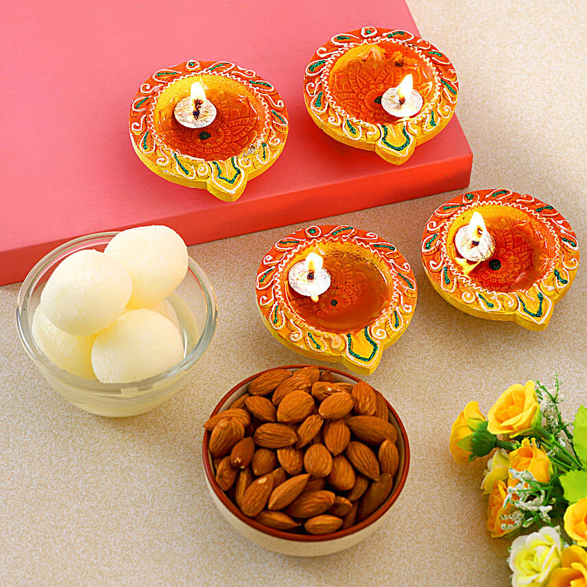 Decorative Diwali Diyas With Almonds And Rasgulla