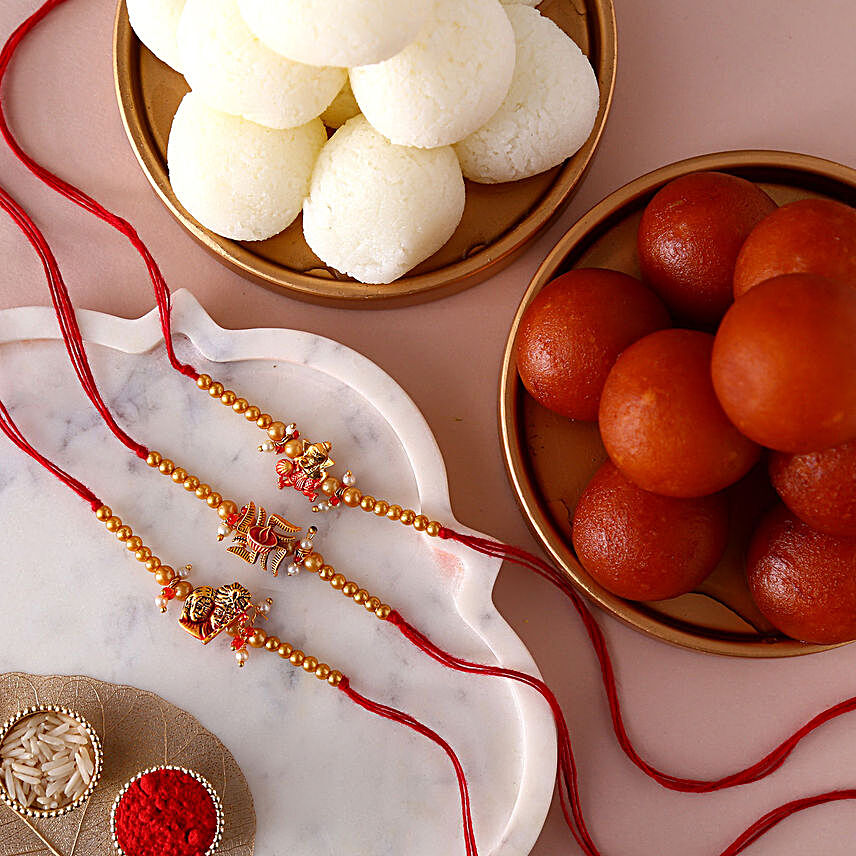 Sneh Devotional Rakhis & Sweets Tin:Rakhi and Sweets to Germany