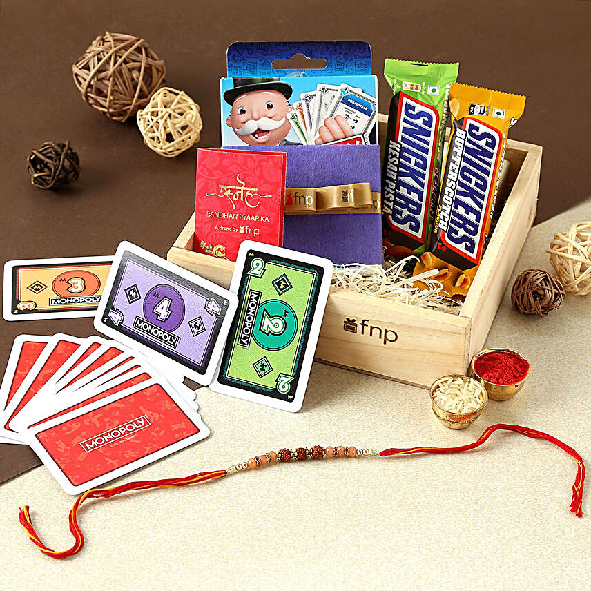 Sneh Rudraksha Rakhi With Snickers N Monopoly Game:Rakhi With Gift Hampers To Germany