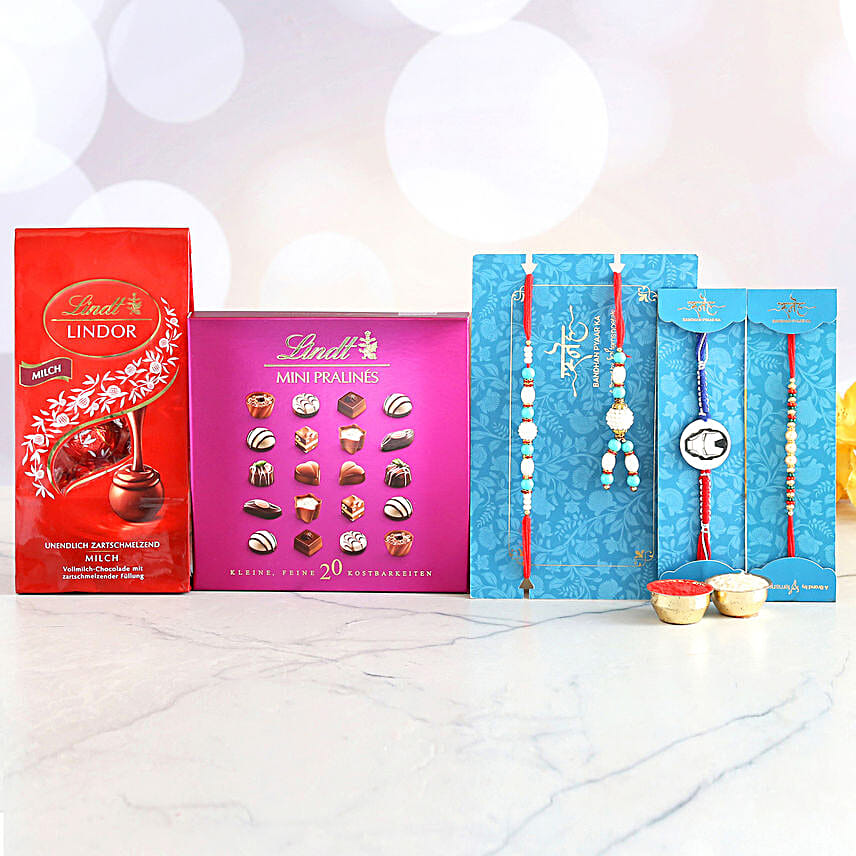 4 Striking Rakhis And Delectable Chocolate Hamper