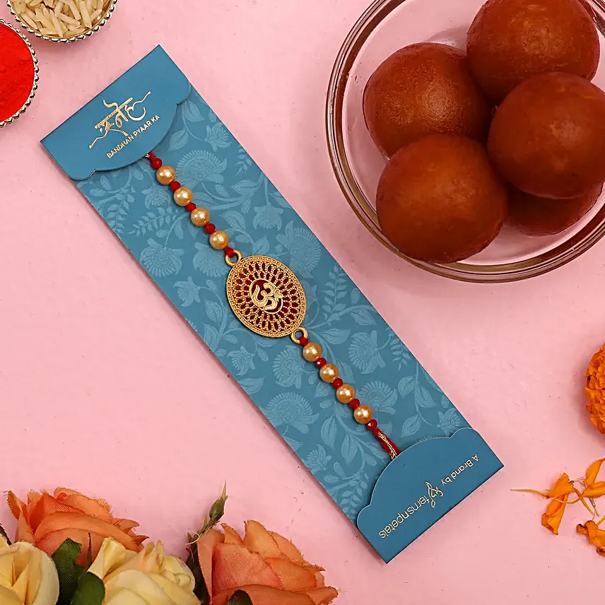Auspicious Om Pearl Rakhi And Gulab Jamun