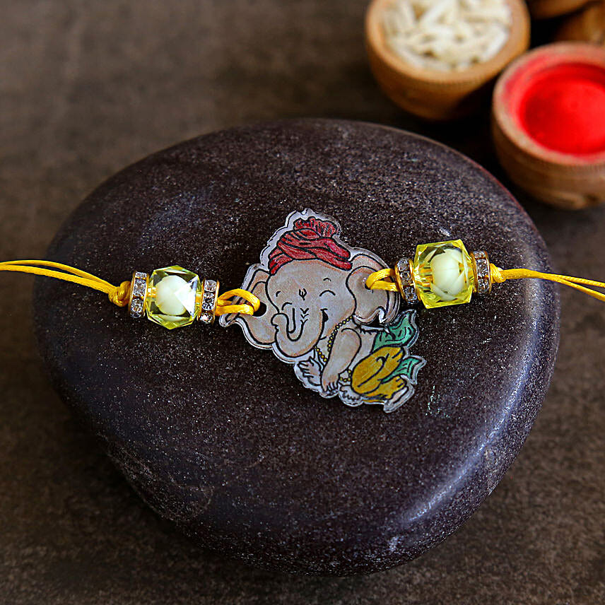 Ganeshji Kids Rakhi And Milka Peanut Chocolate