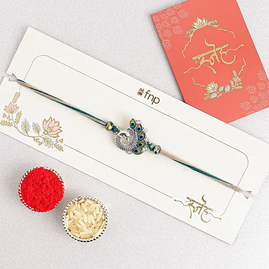 Sapphire Serenity Peacock Rakhi with Dodha Barfi Combo