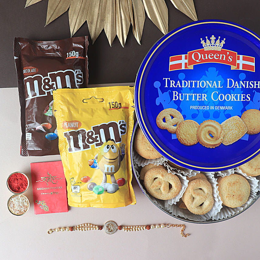 Sneh Exquisite Pearl Om Rakhi & Cookies Hamper
