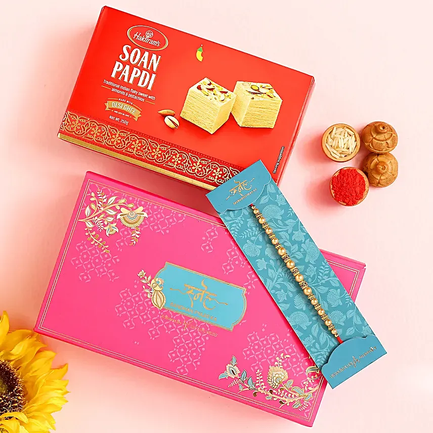 Traditional Pearl And Mauli Rakhi With 250 Gms Soan Papdi