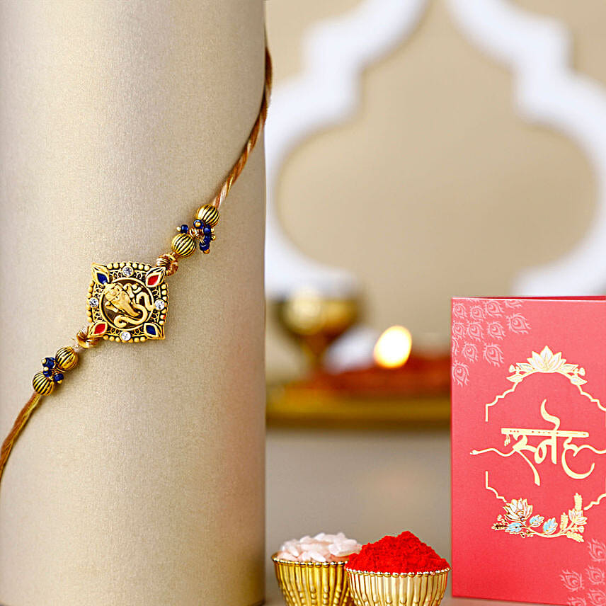 Celestial Ganesha Serenade Rakhi with Channa Barfi Combo