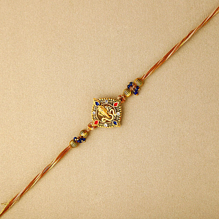 Celestial Ganesha Serenade Rakhi with Channa Barfi Combo