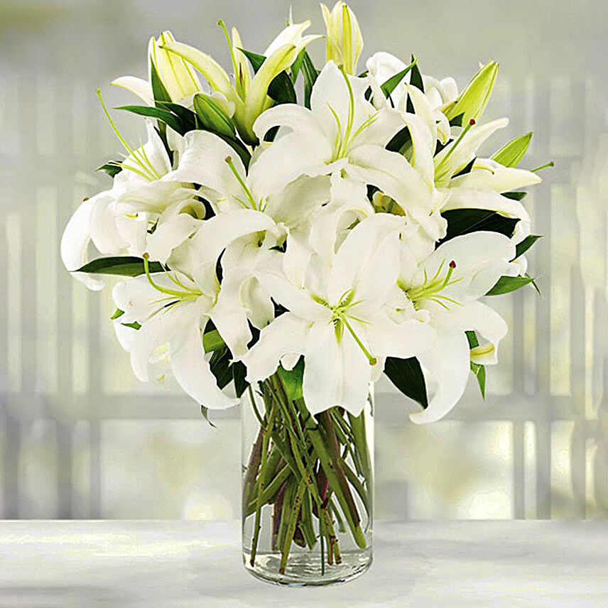 Serene Arranagement Of Lovely White Lilies:Condolence Flowers to Indonesia