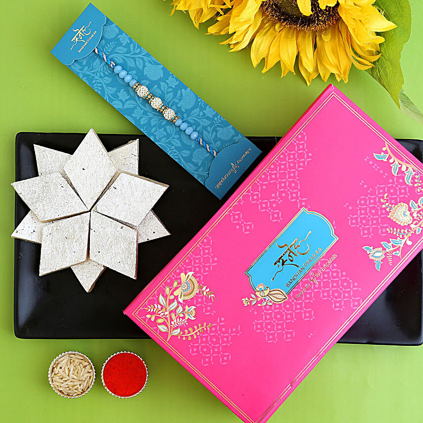 Sea Blue Pearl And Thread Designer Rakhi With Kaju Katli:Rakhi With Sweets To Indonesia