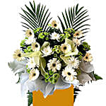 Alluring Mixed Flowers Arrangement In Brown Stand