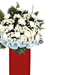 White Chrysanth White Pom Arrangement In Red Stand