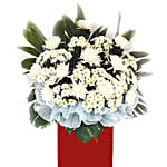 White Chrysanth White Pom Arrangement In Red Stand