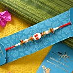 White Beads Rakhi With Laddoo And Pistachios
