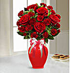 Red Blend Of Roses And Carnation In A Glass Vase