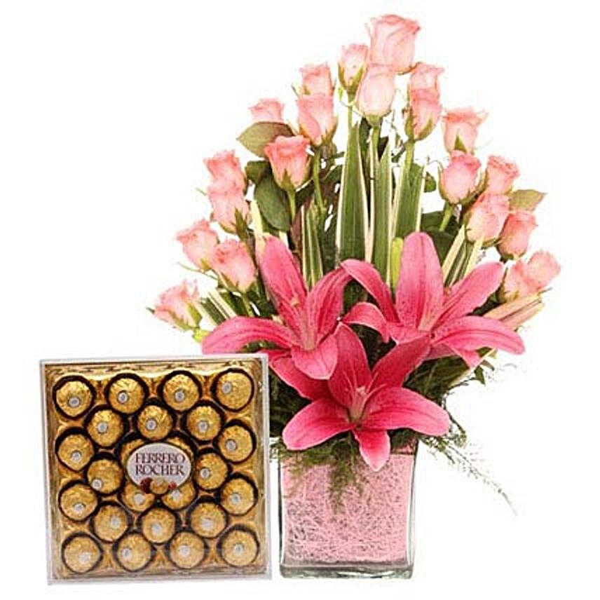Pink Sweetness Reflected - Glass vase arrangement of 20 pink roses with 2 pink asiatic lilies and Ferrero Rocher chocolates.:Diwali Gifts to Kanpur