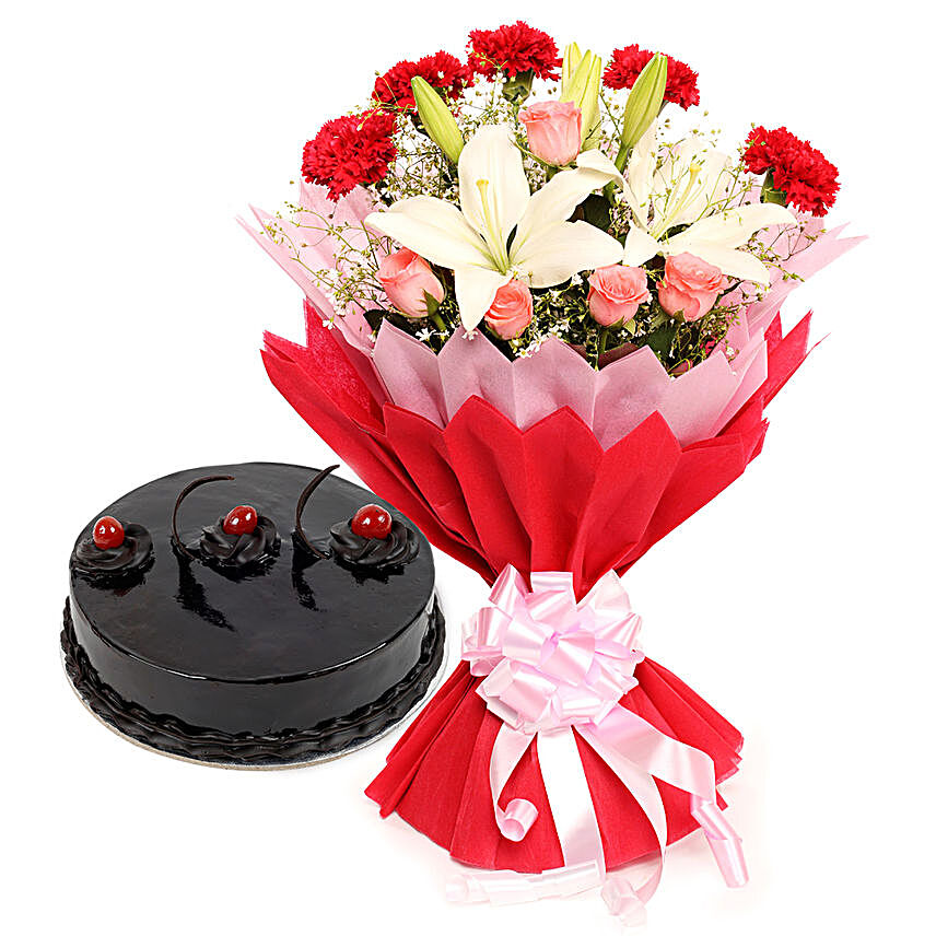 Enchanted Bloom - Bunch of 2  Asiatic Lilies, 5 Red Carnations and 5 Pink Roses in a two layer paper packing and half kg truffle gifts:Send Flowers to Jhajjar