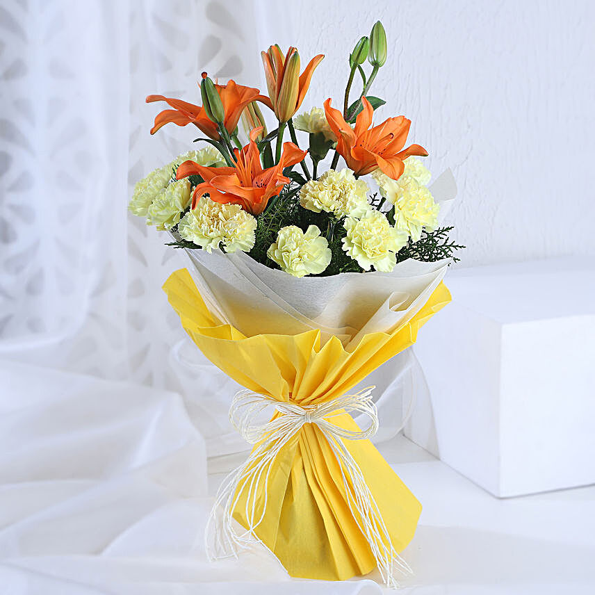 Radiance - Bunch of 10 yellow carnations 2 orange lilies in paper packing.:Exotic Flowers
