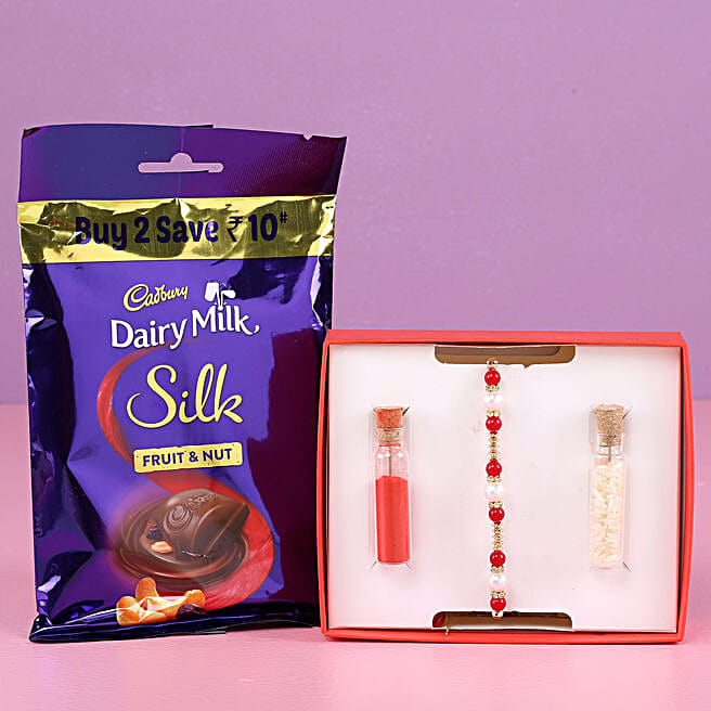 Buy/Send Pearl Rakhi & Dairy Milk Silk Fruit N Nut Pack Online FNP
