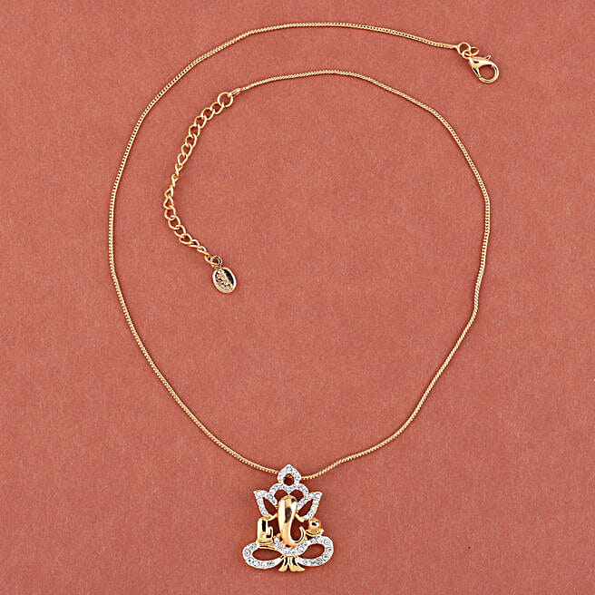 Buy/Send Gold Plated Ganesha Pendant Capsule Rakhi Online- FNP