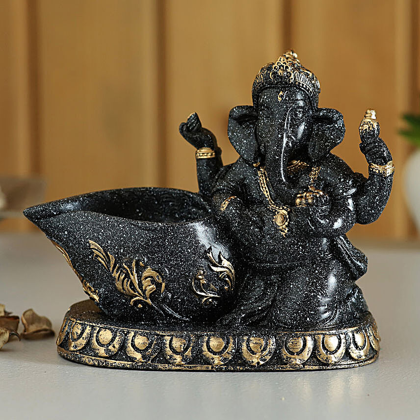 ganesha idol with diya:Ganesh Chaturthi Gifts
