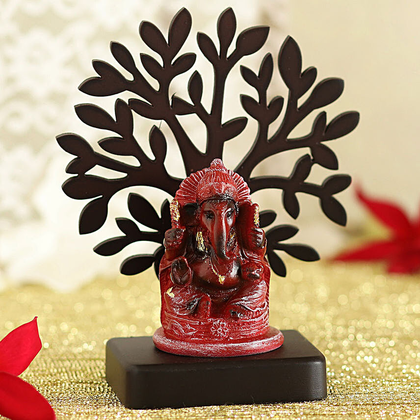 Red Ganesha Idol Under A Tree
