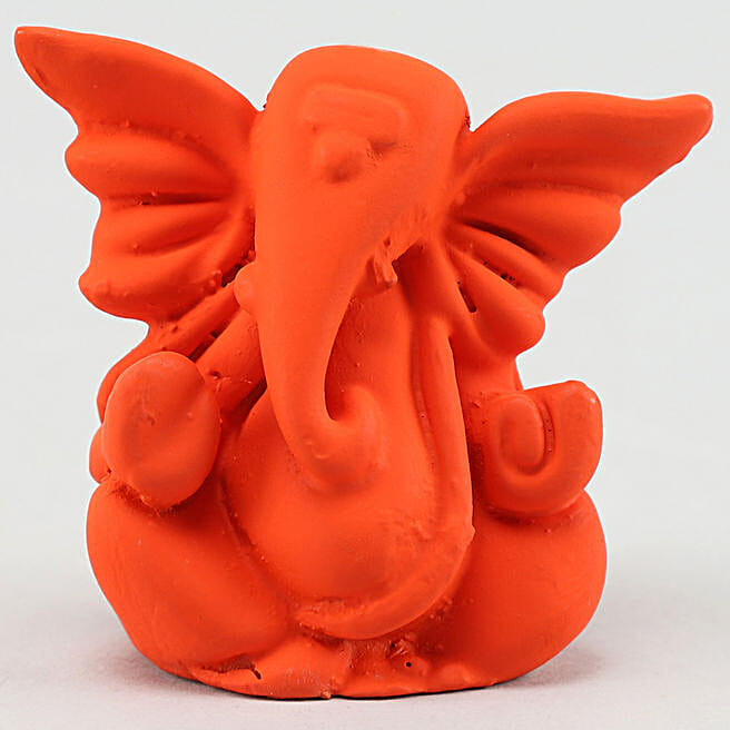 Buy/Send Orange Ganesha Idol & Cadbury Combo Online Ferns N Petals