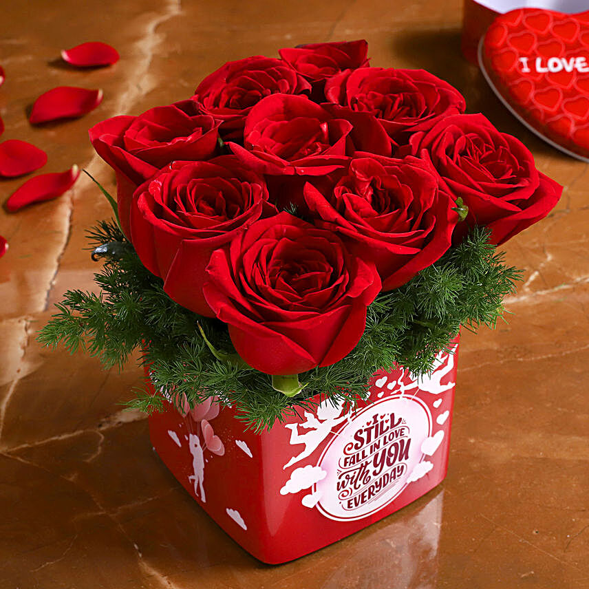 red roses in printed vase arrangement for valentine