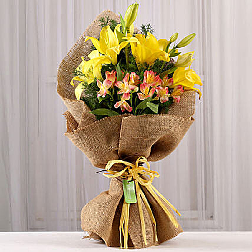 lilly and pink alstomeria in jute bouquet:Lilies to Mumbai