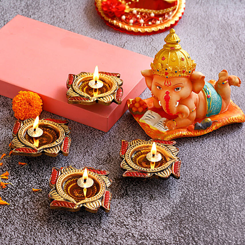4 Swastik Diyas & Cute Bal Ganesha Idol