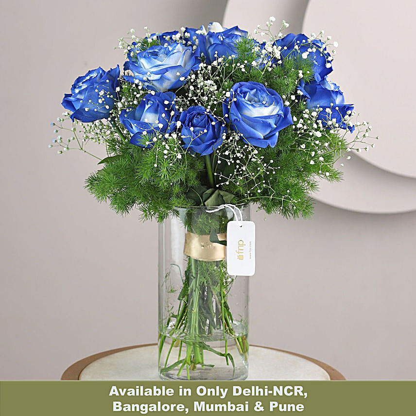 exotic blue shade roses in glass vase arrangement