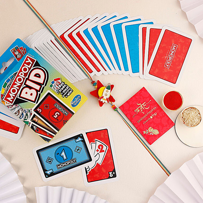 Sneh Rocket Shaped Kids Rakhi and Monopoly Bid Card Game:Rakhi With Toys N Games