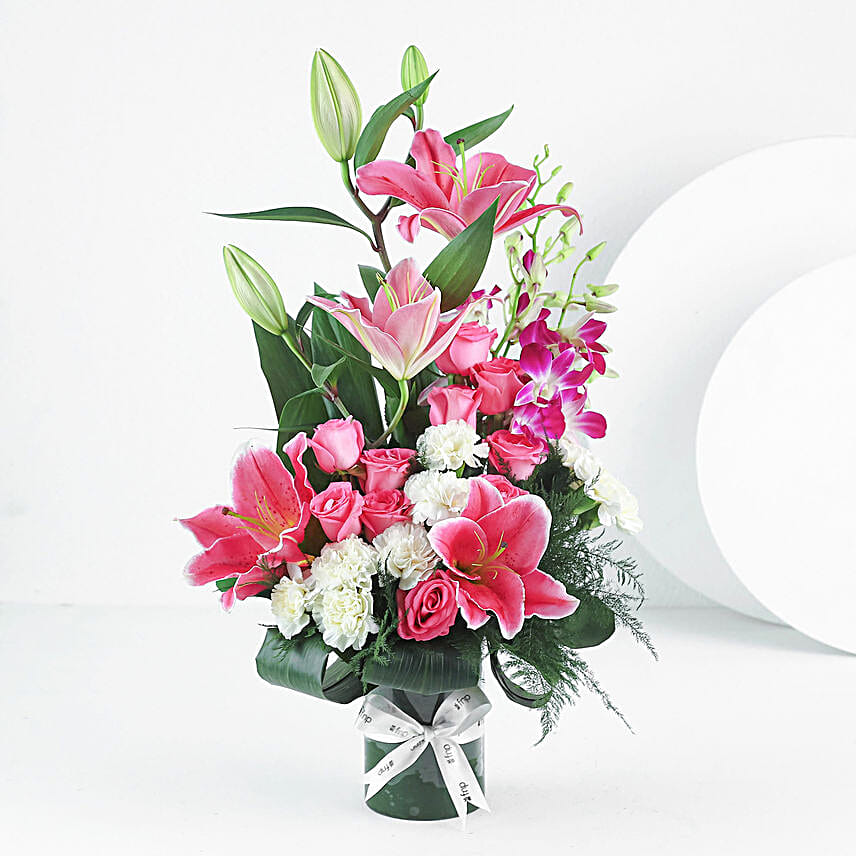 Elegant Mixed Flowers In Cylindrical Vase