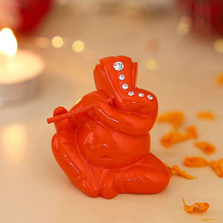 Buy/Send Flute Playing Ganesha- Orange Online- FNP