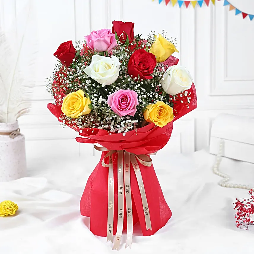 Multicoloured gulal packets, red rose bouquet, gujia hamper