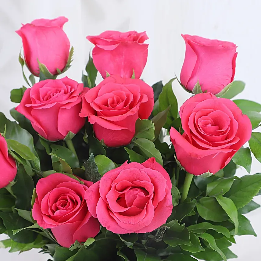 pink roses in attractive vase with truffle cake combo