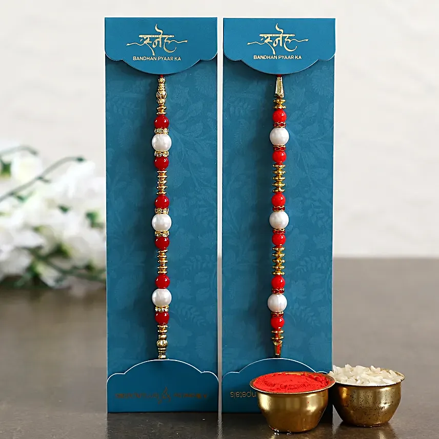 Set of 2 Pearl Rakhi With Celebrations N Dry Fruits