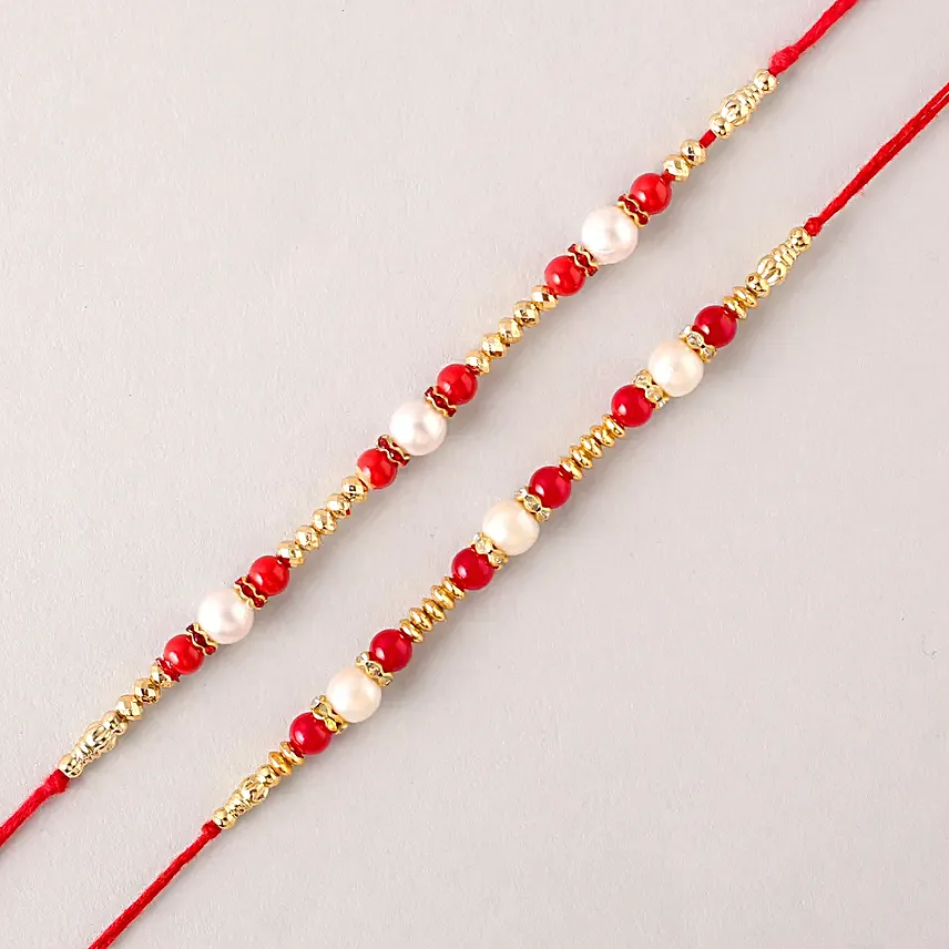 Set of 2 Pearl Rakhi With Celebrations N Dry Fruits