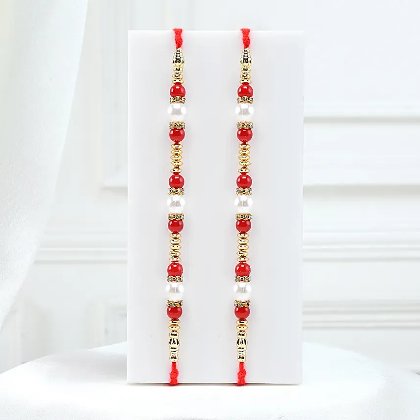 Set of 2 Pearl Rakhi With Celebrations N Dry Fruits