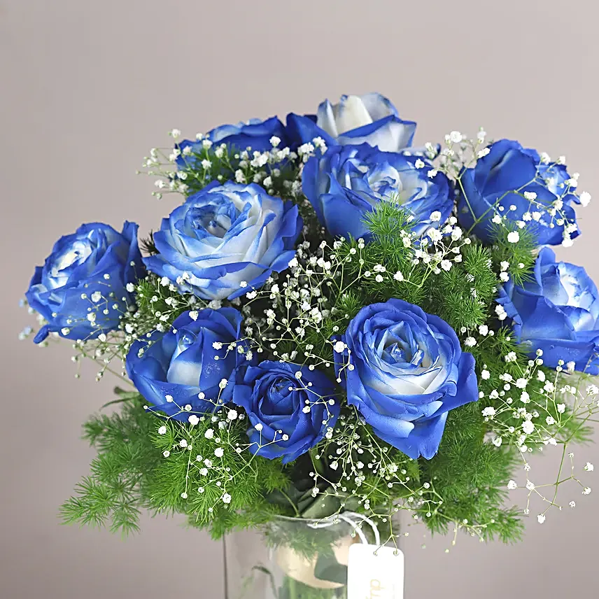 exotic blue shade roses in glass vase arrangement