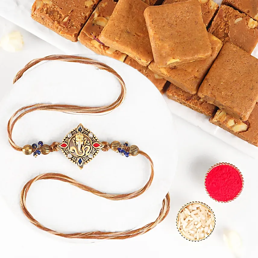 Celestial Ganesha Serenade Rakhi with Channa Barfi Combo