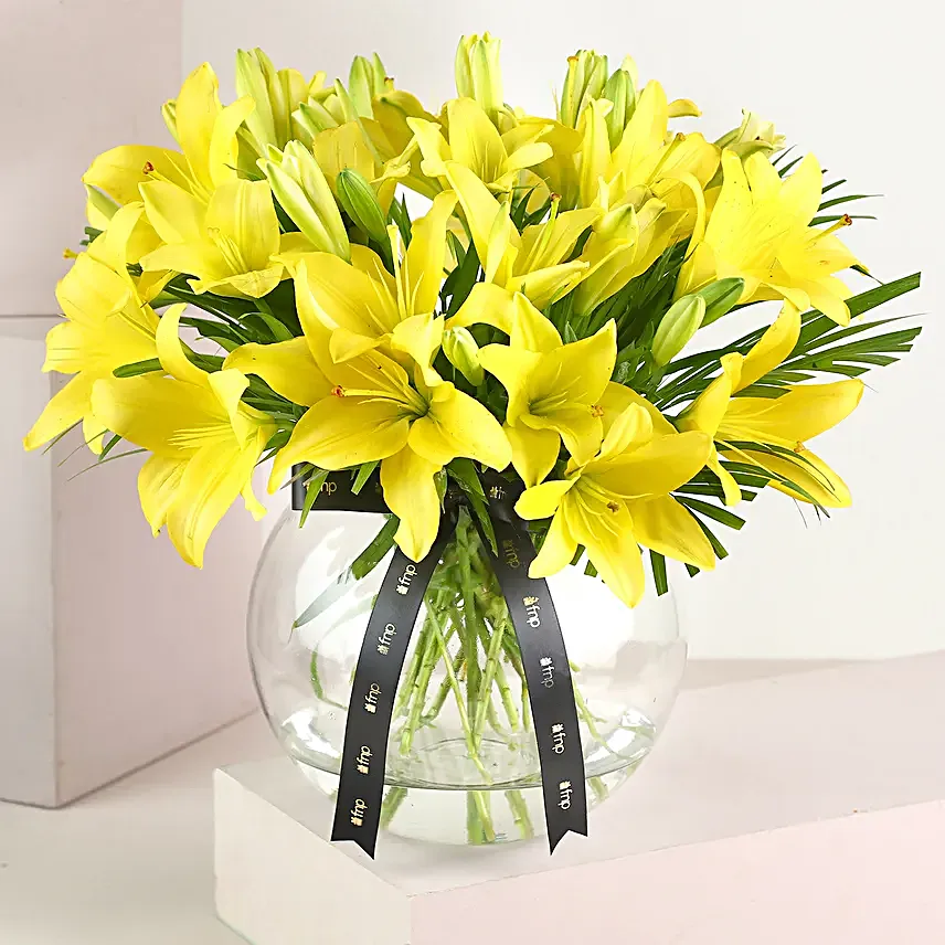 Cheerful Yellow Color Lilies In Fishbowl Vase