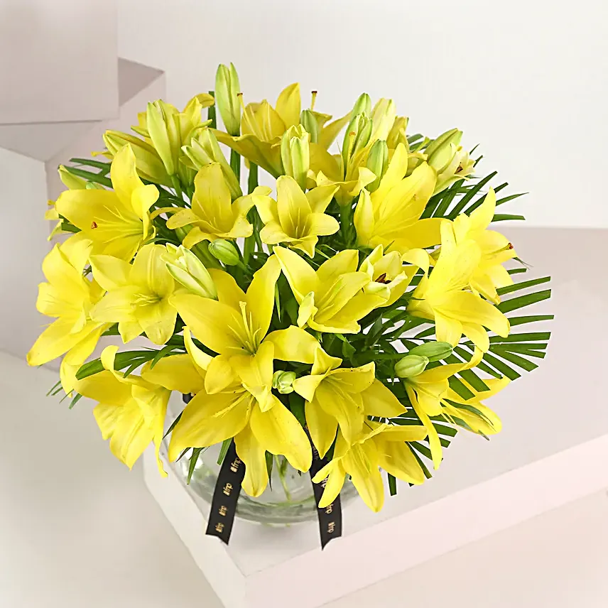 Cheerful Yellow Color Lilies In Fishbowl Vase