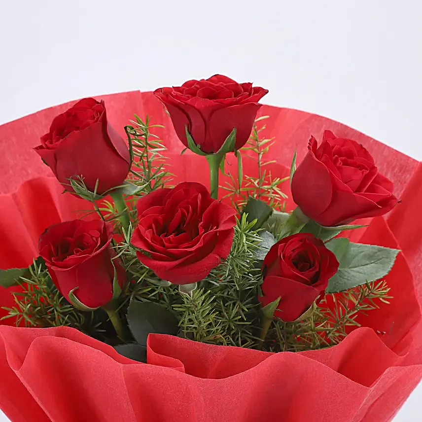 Delightful Divine - Bunch of 6 Red Roses with Pineapple Cake 500gms.