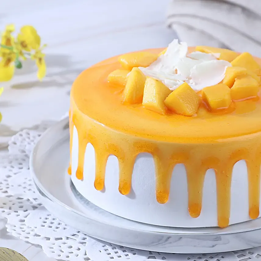 Dripping Mango Cream Cake Eggless