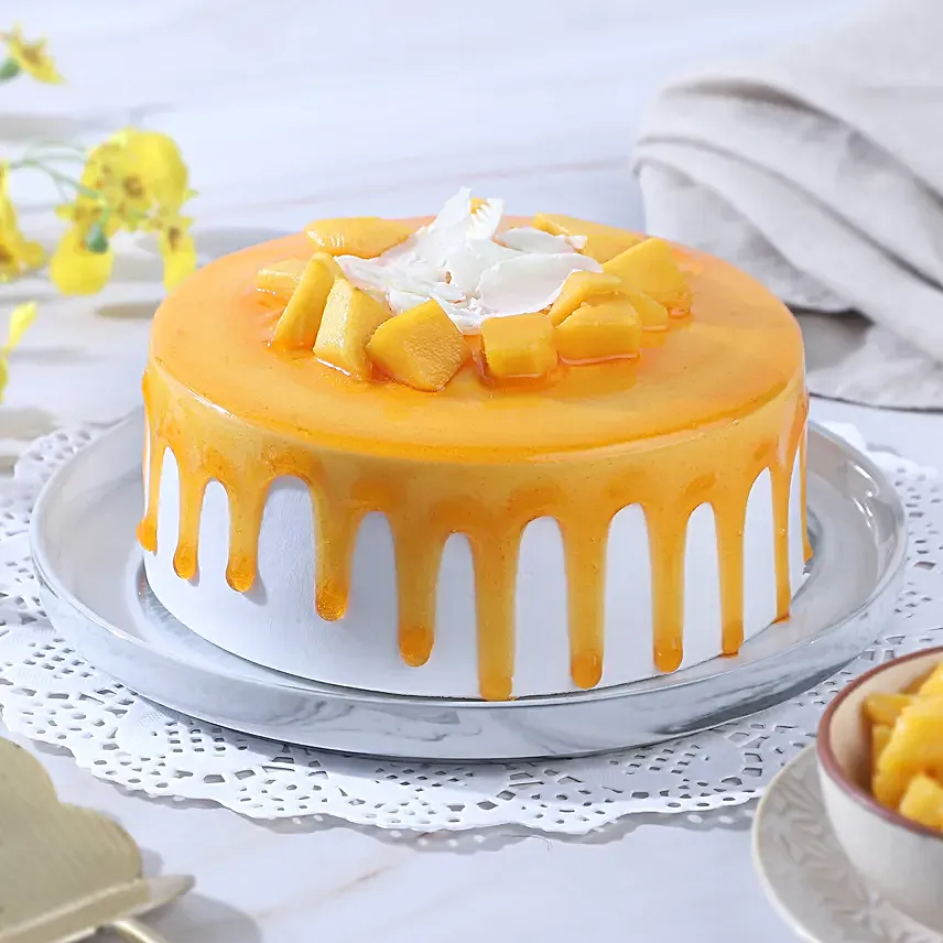 Dripping Mango Cream Cake Eggless