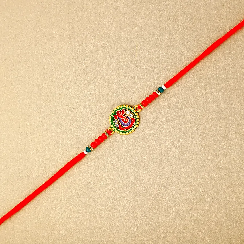 Enigmatic Ganesha Essence Rakhi N Pineapple Cake