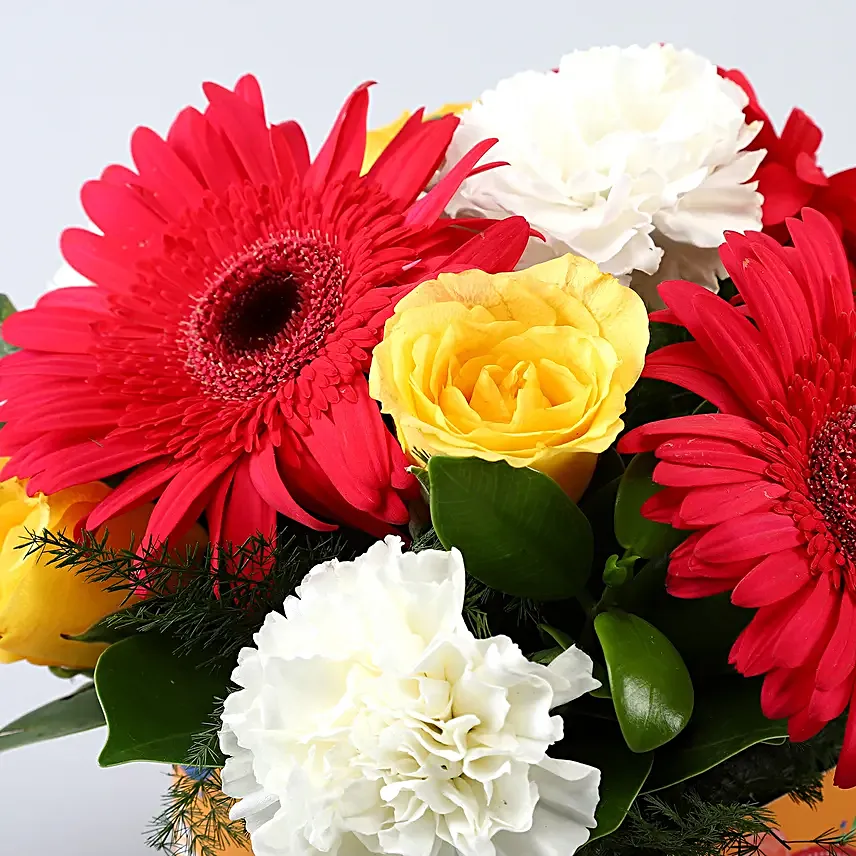 Exotic Mixed Flowers In Orange Bday Vase