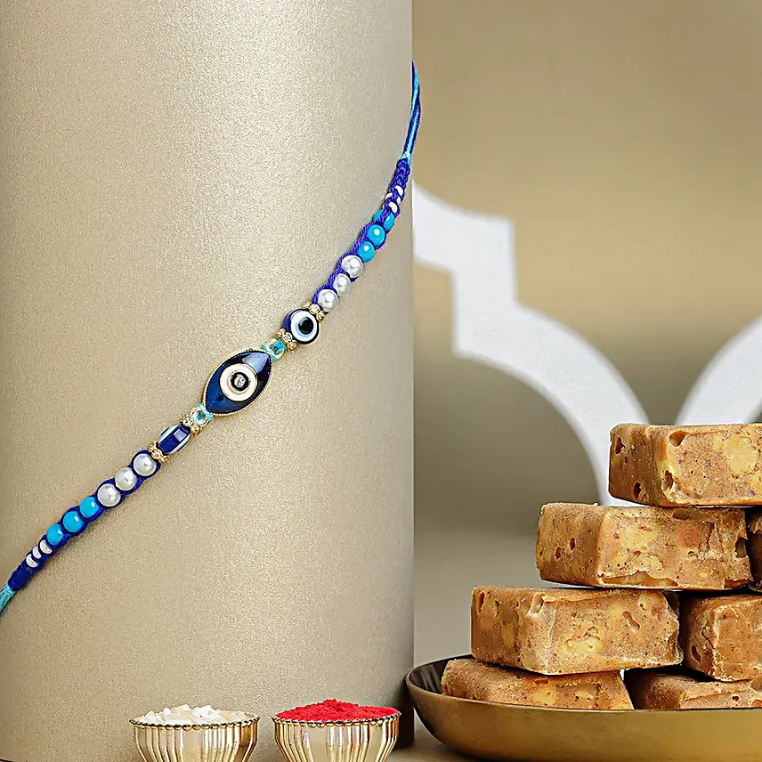 Galactic Blue Protector Evil Eye Rakhi with Channa Barfi Combo