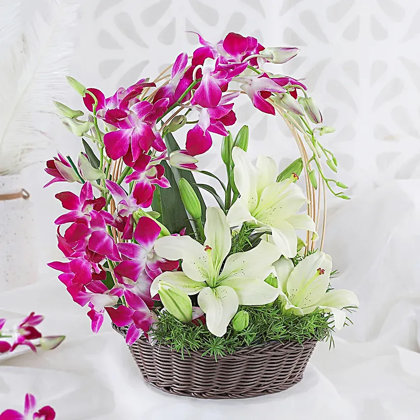Always Works - Basket arrangement of 2 White asiatic lilies and 6 Purple Orchids.